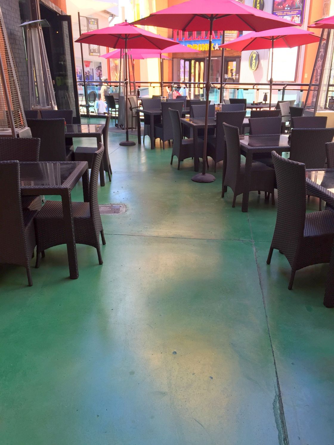 Commercial green stained concrete patio at Universal Citywalk, Los Angeles