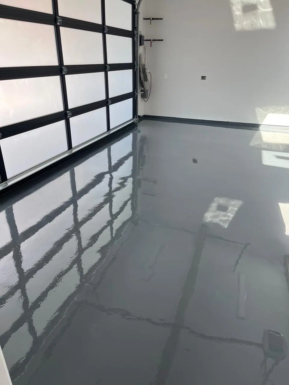 Solid dark blue epoxy floor in a modern home in Malibu, CA